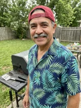Backyard photo of the man in a Hawaiian shirt