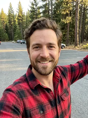 Parking lot selfie of the bearded man in flannel