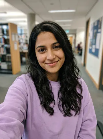 Library selfie of the daughter in a lavender sweatshirt