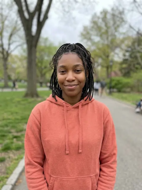 Good photo for a Crazy Frog AI video: a waist-up photo facing the camera in a park